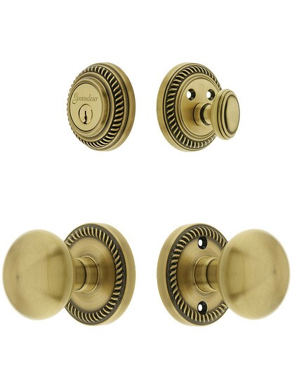 Grandeur Newport Entry Door Set, Keyed Alike with Round Brass Knobs in Antique Brass.